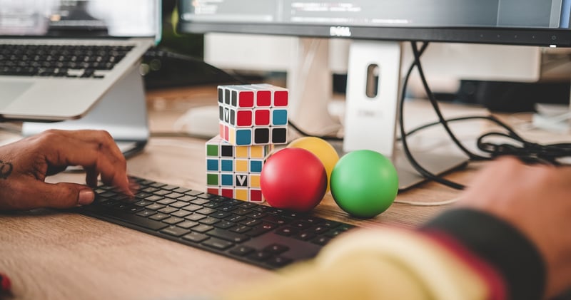 Creative computer game developer at desk and keyboard