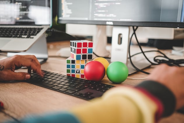 Creative computer game developer at desk and keyboard