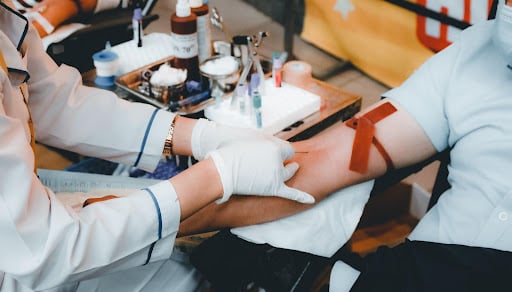 Phlebotomist drawing blood