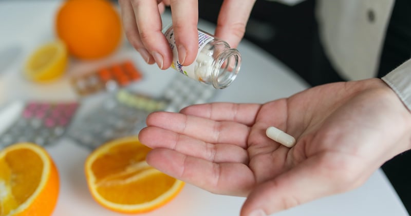 Person Taking Pill