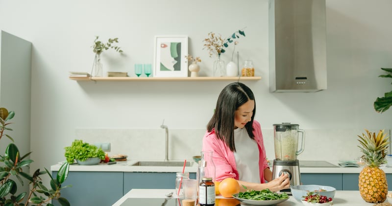 A Woman Using a Blender