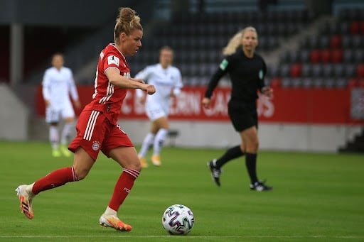 Women playing soccer