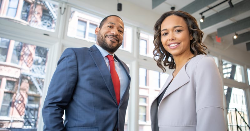 Man and Woman Smiling Inside Building