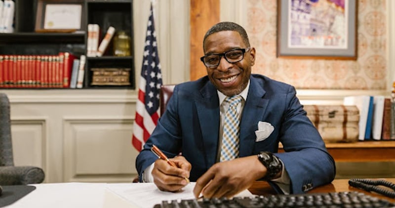 Man signing papers